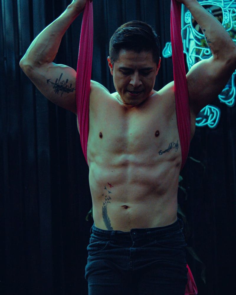 Man performing a controlled strength exercise focused on stability.